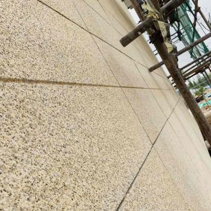 林芝 黄金麻花岗岩荔枝面外墙干挂石材效果示例