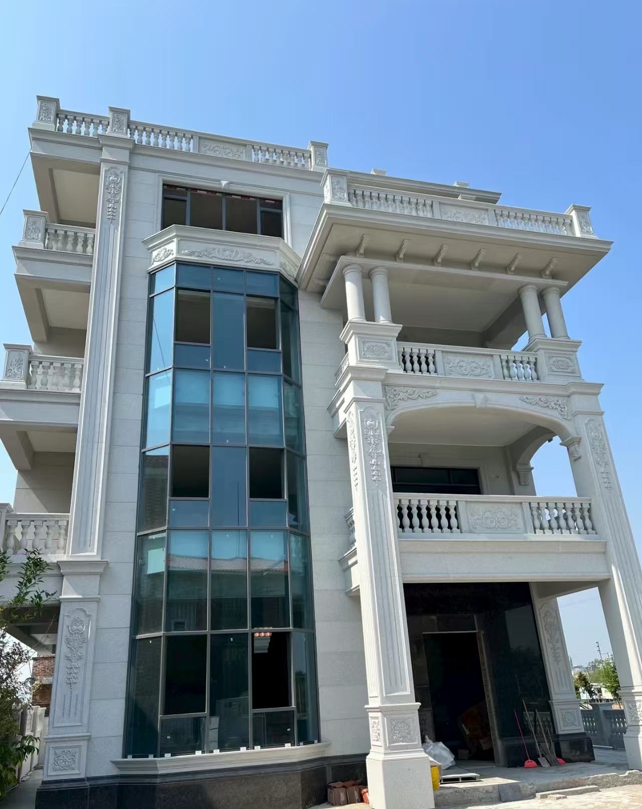 林芝 白麻花岗岩别墅外墙干挂效果展示